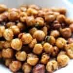 Close up of crispy chickpeas in a white bowl.