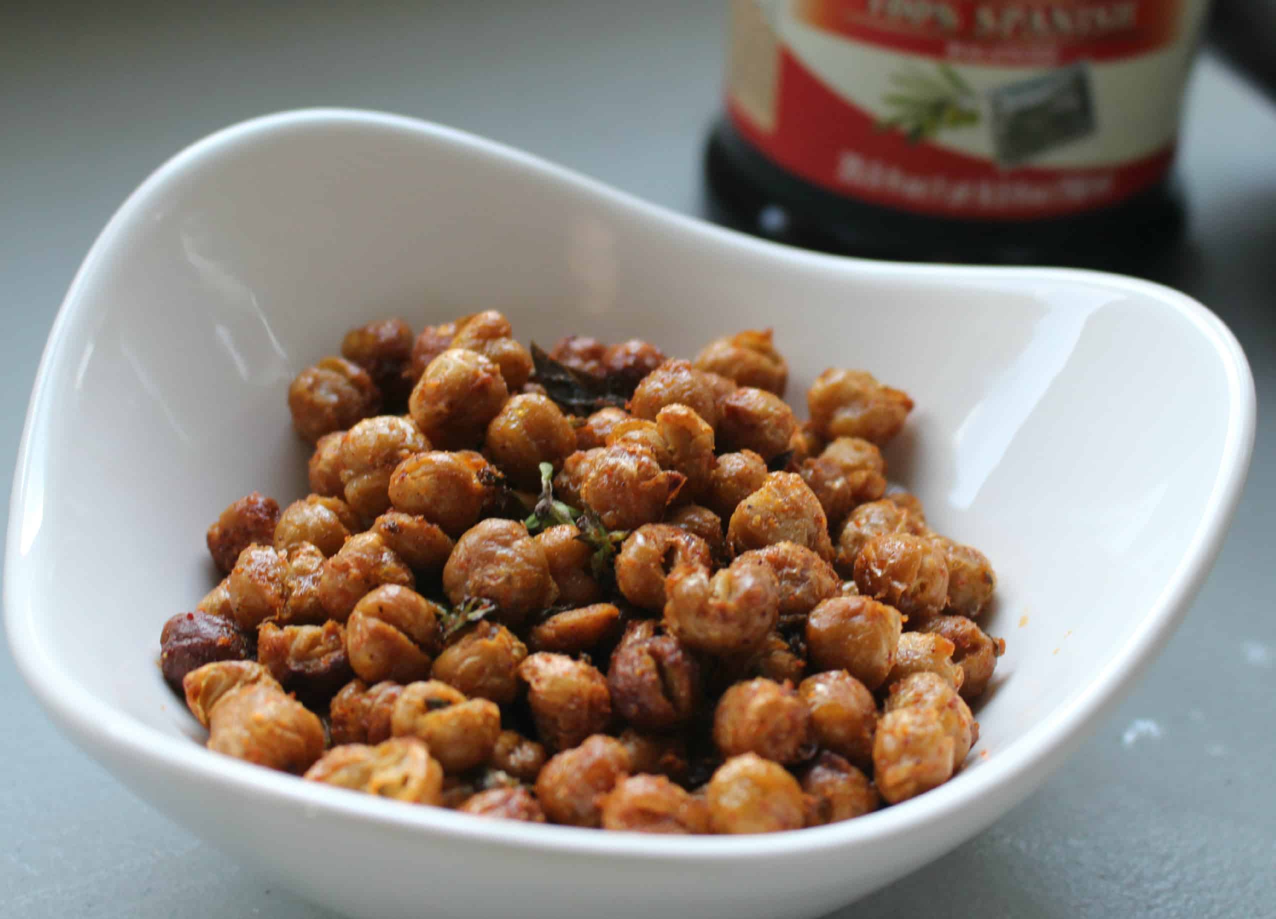 A small white bowl of roasted crispy chick peas.