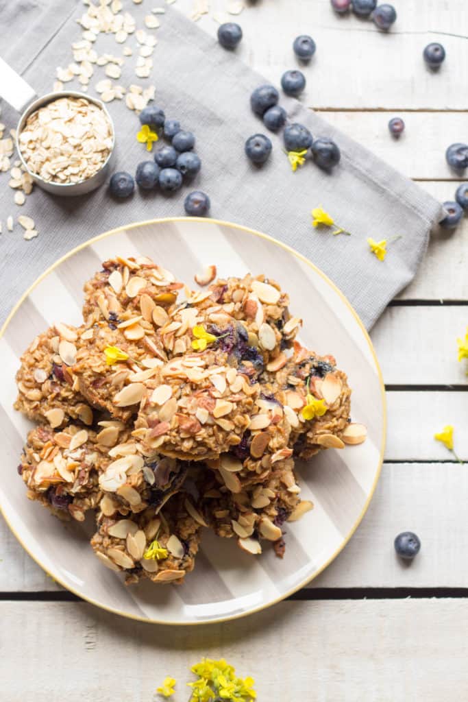 Mini blueberry almond oatmeal cups on a dinner plate.