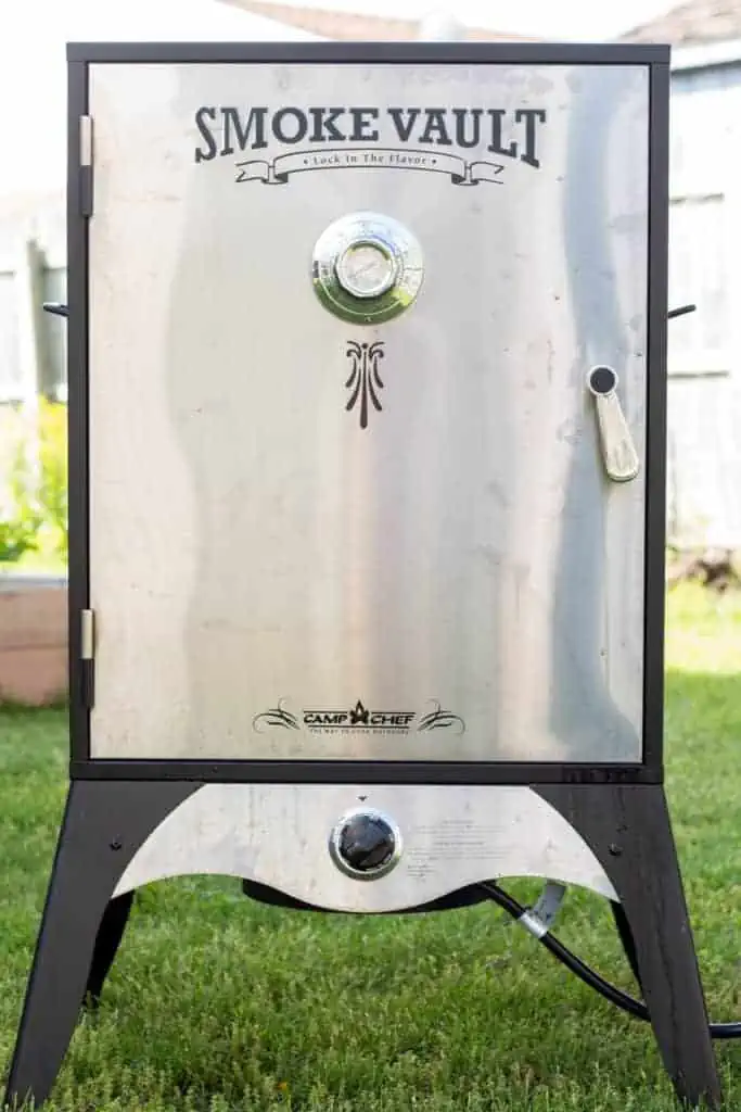 Front view of a cabinet style meat smoker.