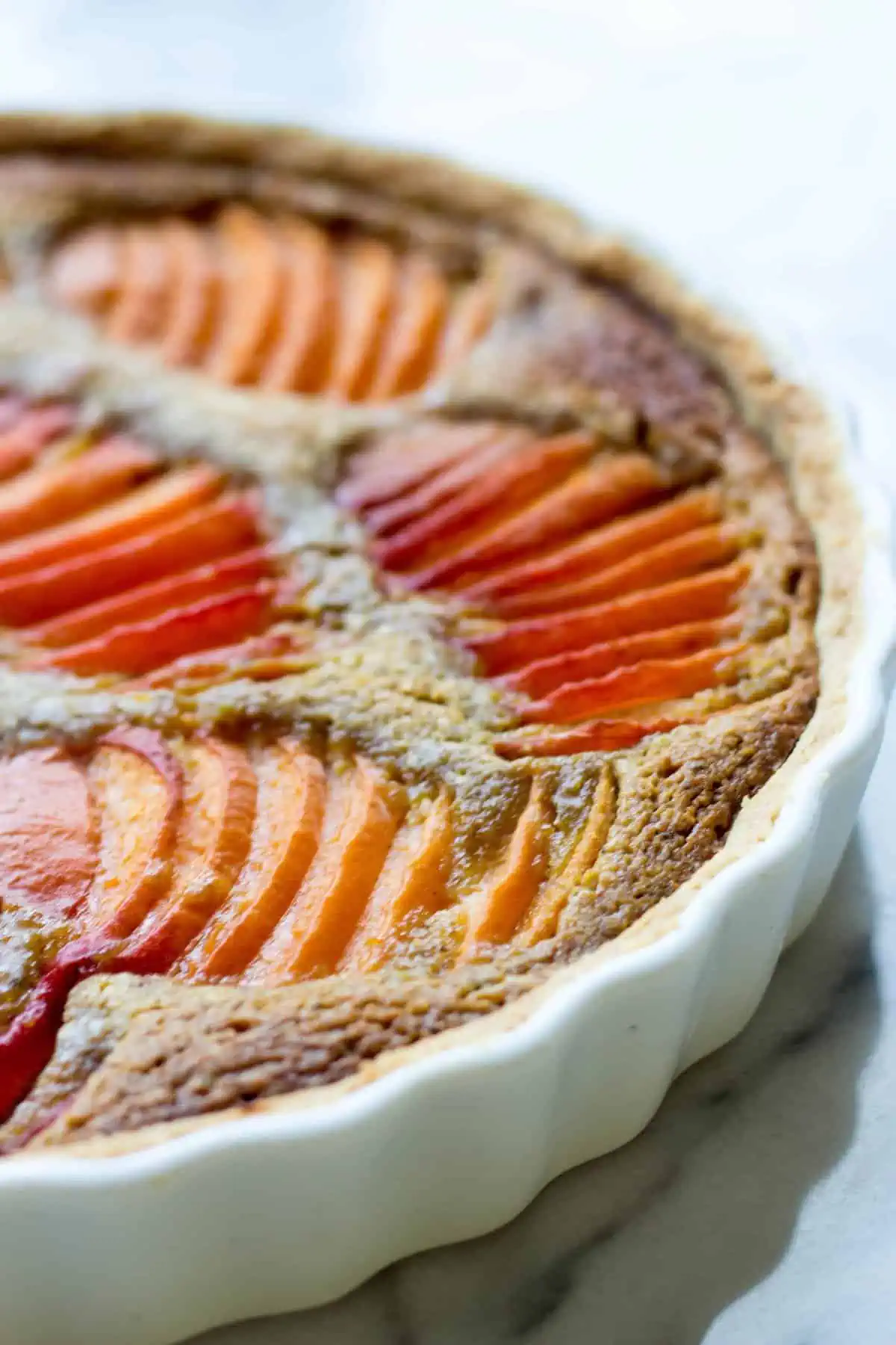 Close up of baked apricot pistachio tart.