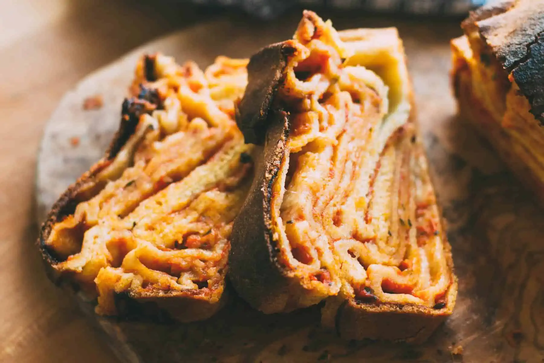 Thick slices of cooked pizza babka.