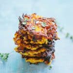 A vertical stack of butternut squash fritters.