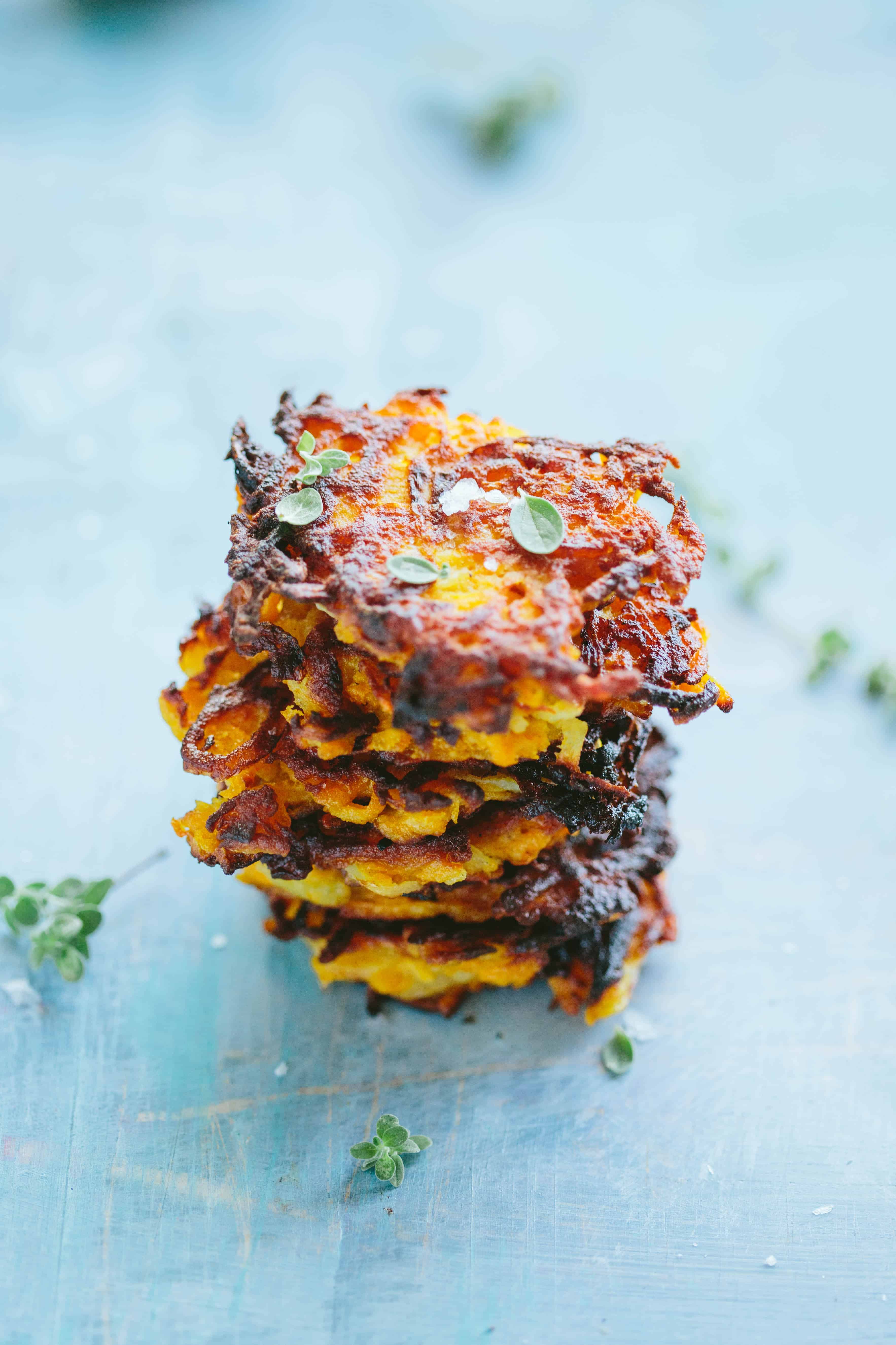 A vertical stack of butternut squash fritters.