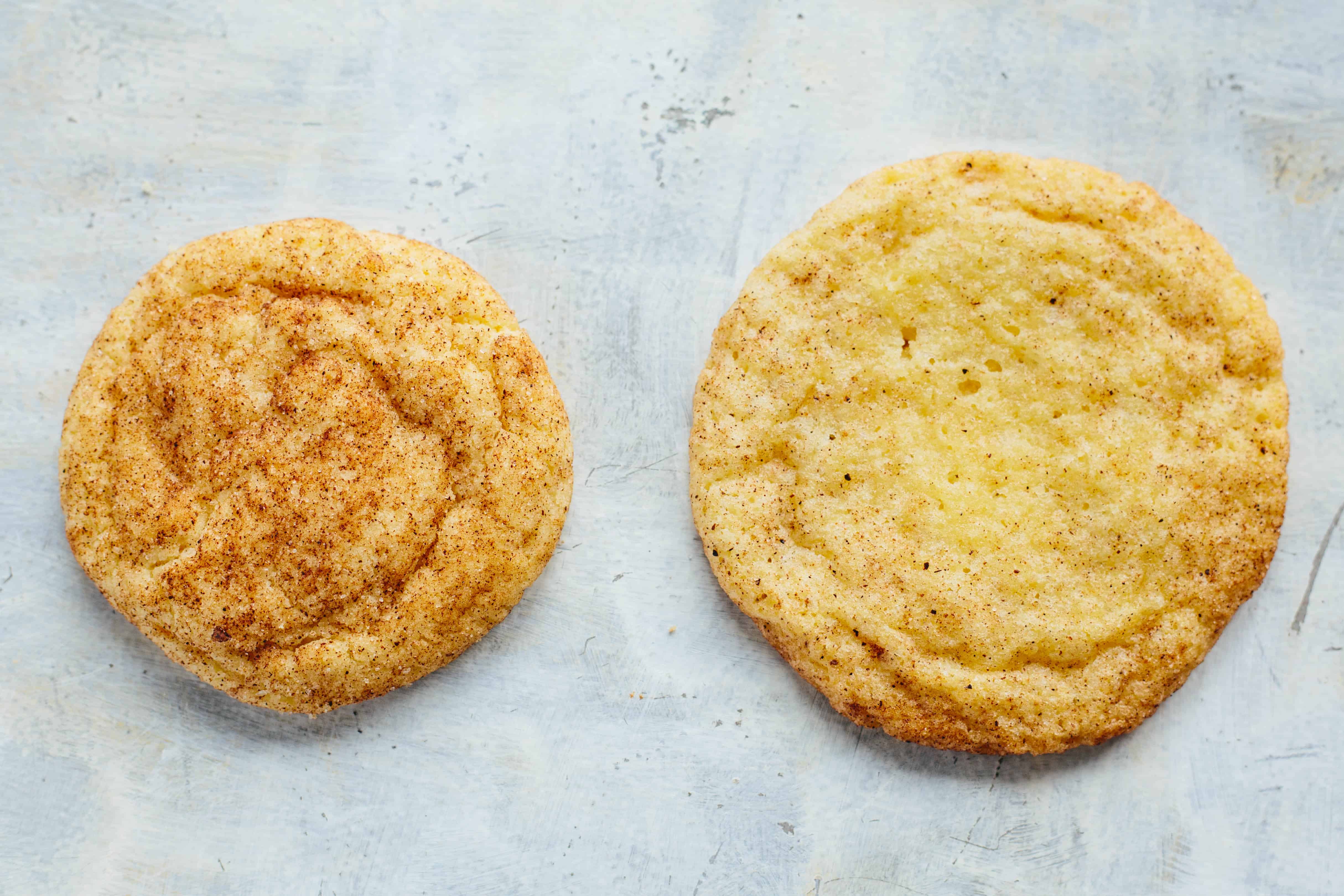 Close up top view of two chai snickerdoodle cookies.