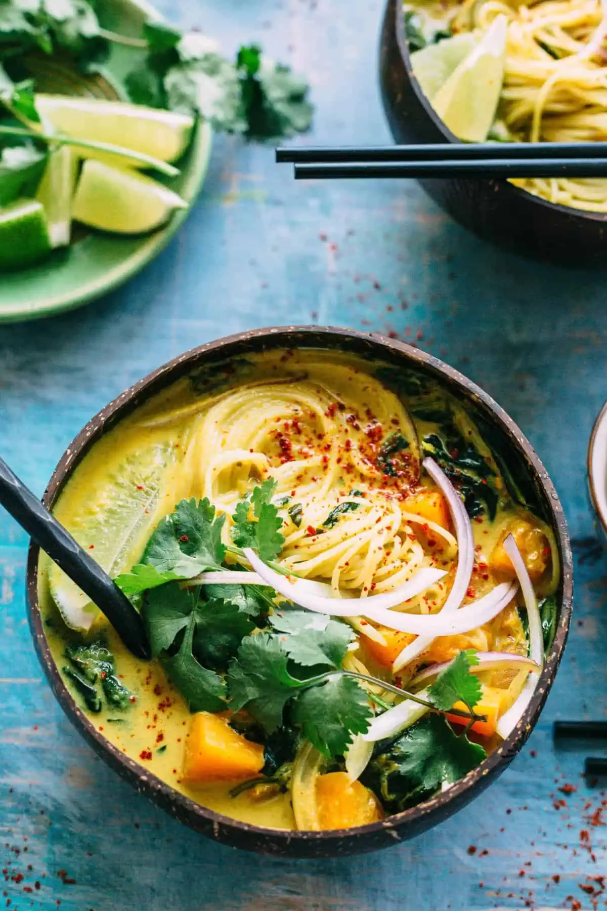 This Butternut Squash + Spinach Coconut Curry Noodle Soup is an easy, warm and flavorful soup recipe that's naturally vegan and gluten free! #vegan #gf #glutenfree #rice #noodles #easy #soup #recipe #coconut #curry #spinach | ColeyCooks.com