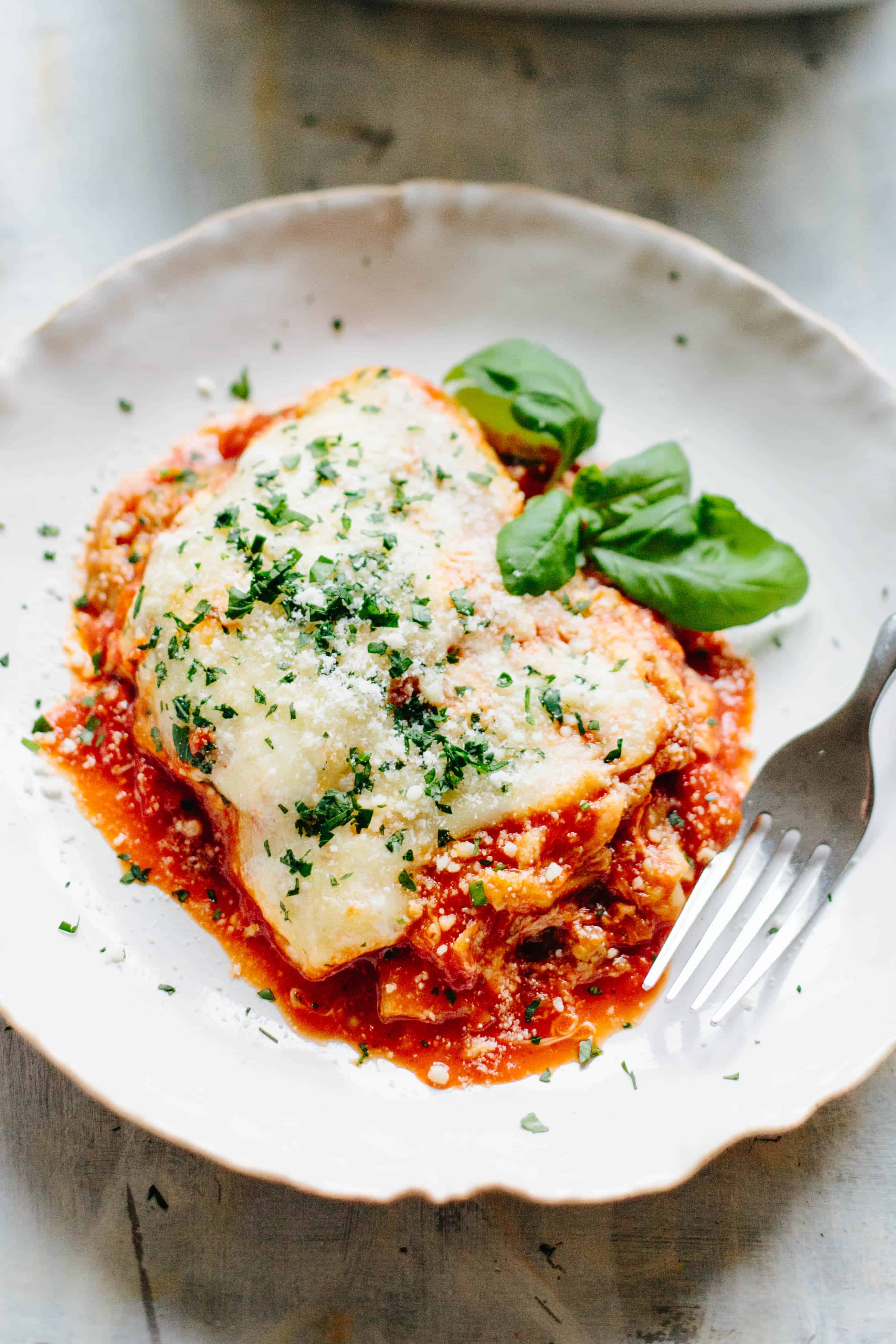 Unbreaded Eggplant Parm is a healthier, gluten free version of my Mom's eggplant parm that's actually more authentic than the original! Made with baked eggplant that isn't coated in any breading, which is how they prepare it on the Amalfi Coast in Italy! #glutenfree #eggplant #parmesan #authentic #Italian #recipe | ColeyCooks.com