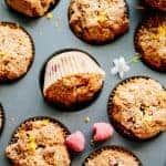 Close up of Paleo orange raspberry muffins baked in a muffin tin.