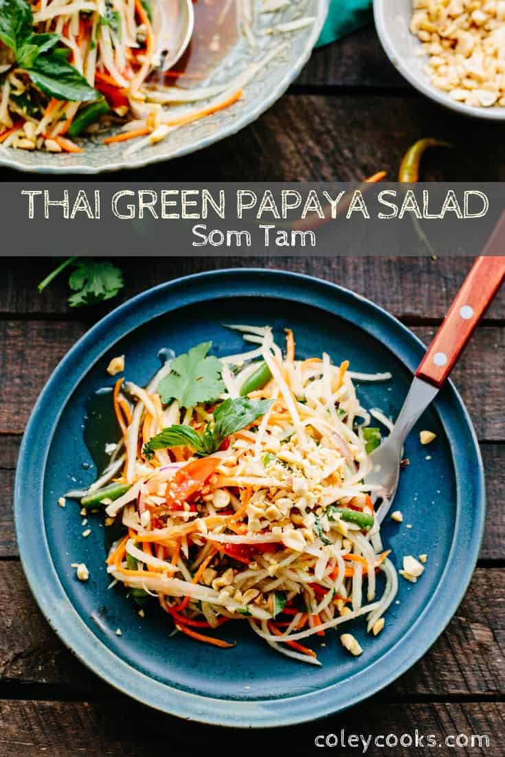 Vertical Pinterest photo of Thai green papaya salad on a plate with a fork.