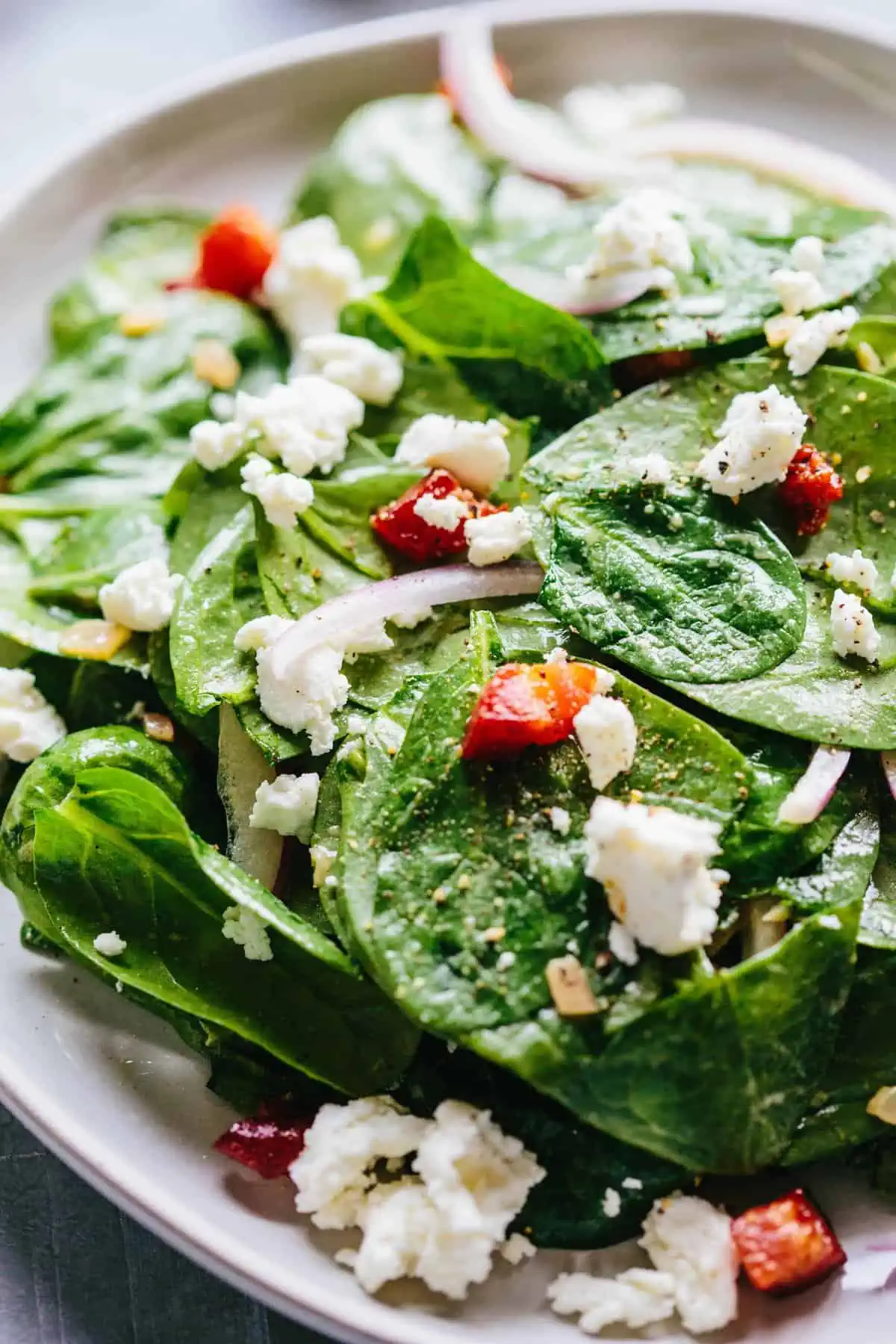 A close up of spinach salad