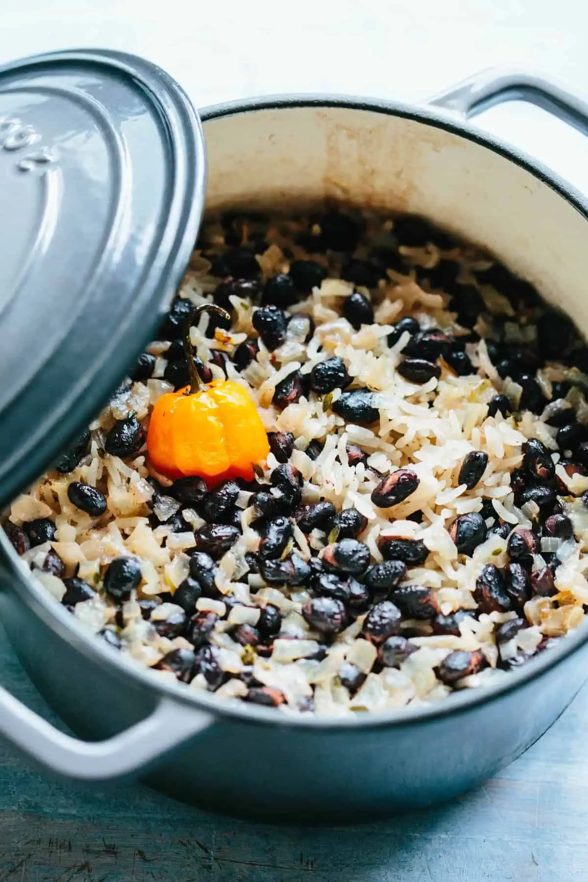 a pot of black beans and rice with a habanero 