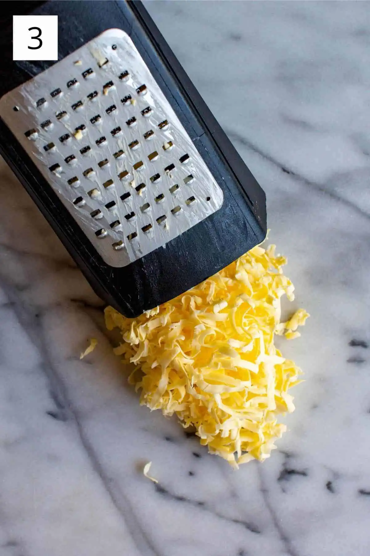 frozen butter grated on a box grater