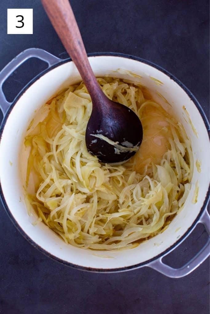 sautéing onions and fennel in butter in a pot with a wooden spoon
