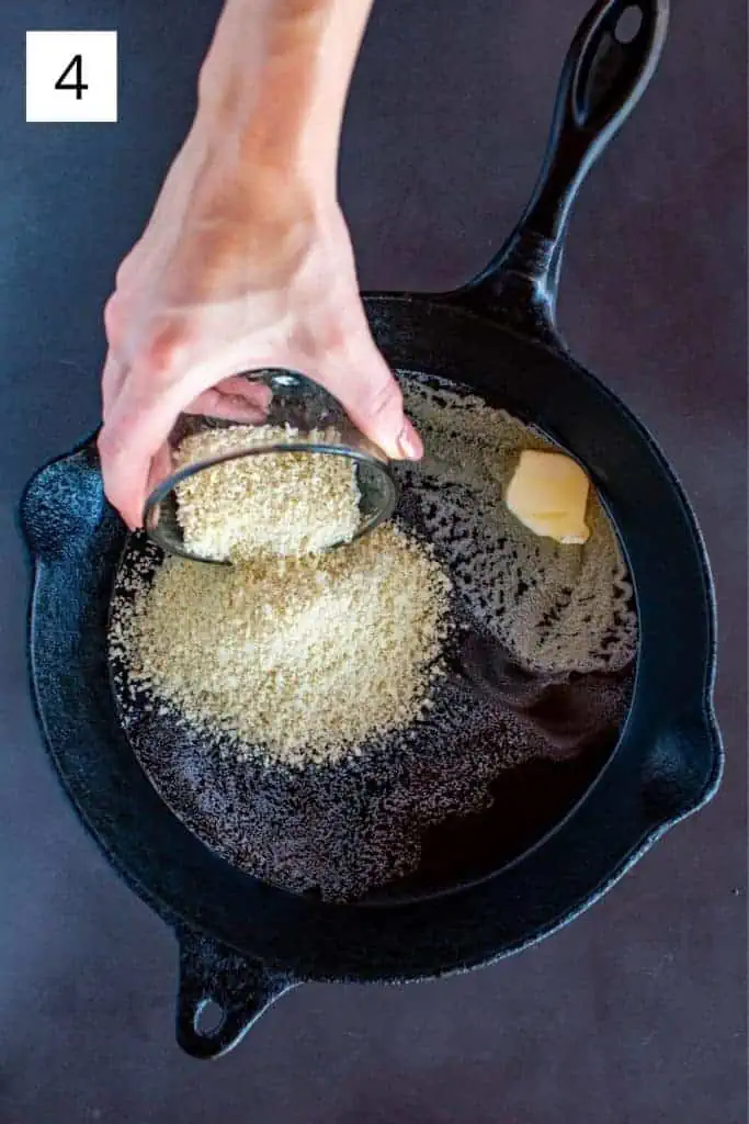 adding Panko to a cast iron skillet with melted butter 