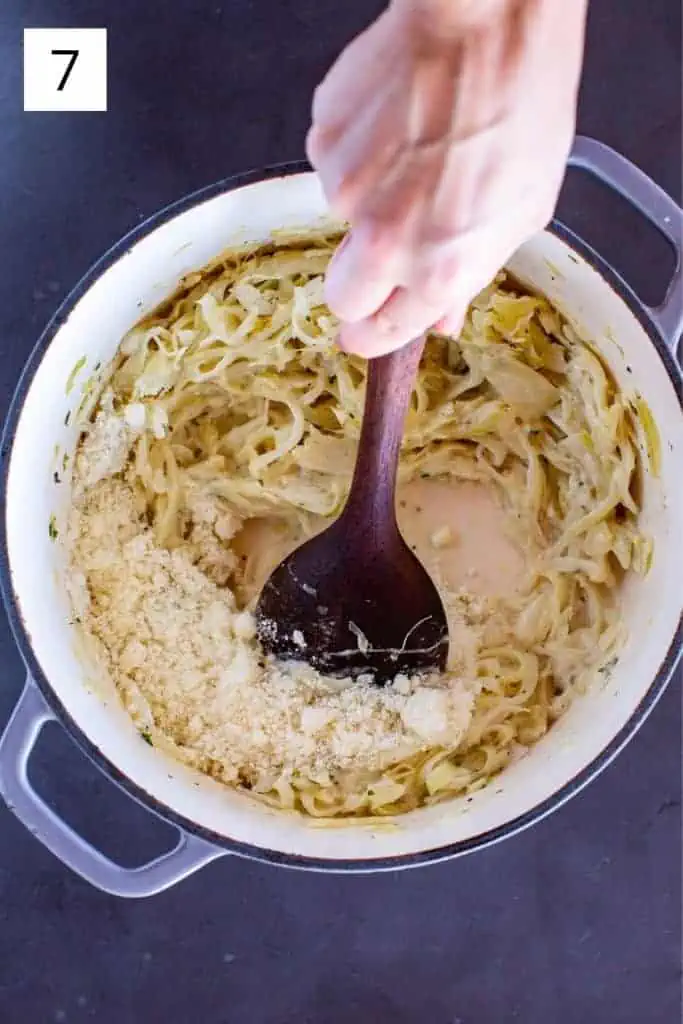 stirring pecorino Romano cheese into pot with cooked fennel and onion