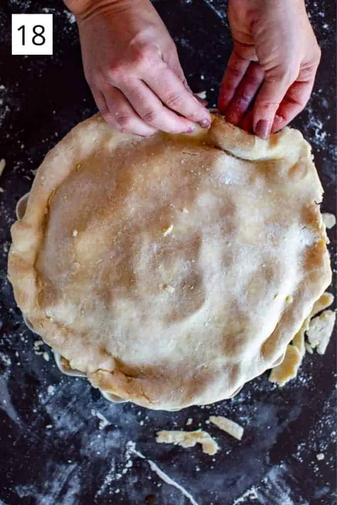 hands folding under edges of pie crust