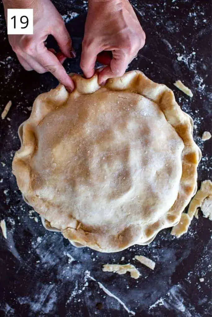 hands crimping the edge of pie crust