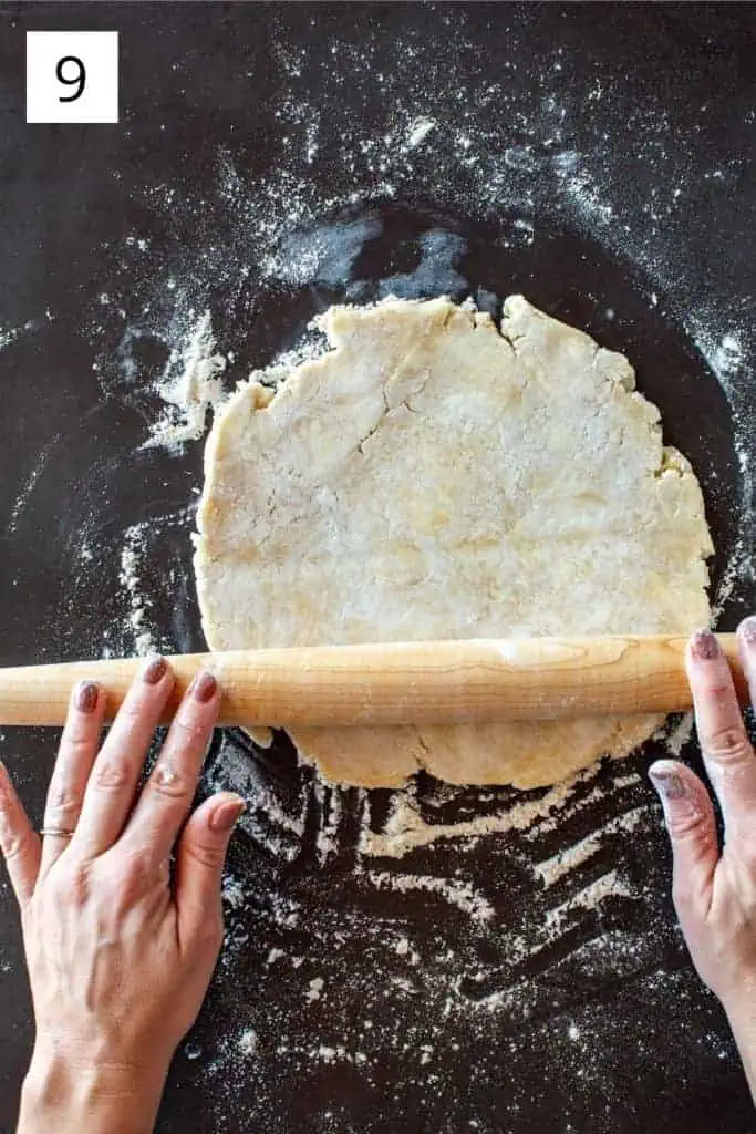 two hand rolling out pie dough with a rolling pin