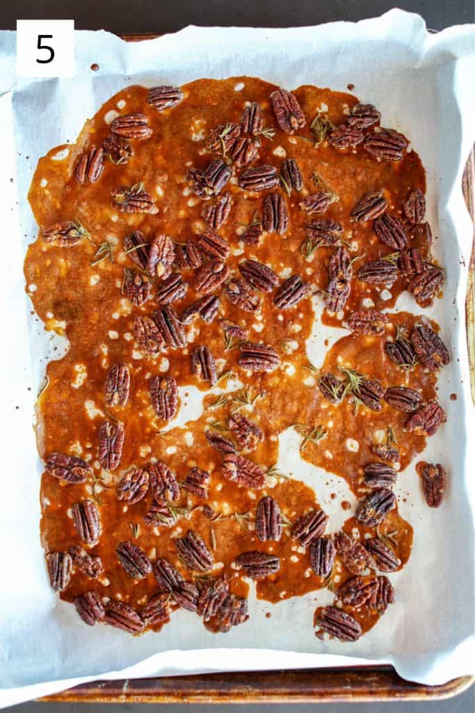 rosemary maple roasted pecans on a sheet pan straight out of the oven