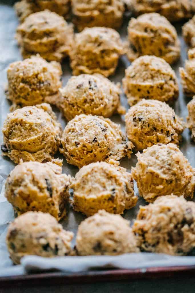 A close up of balls of raw cookie dough