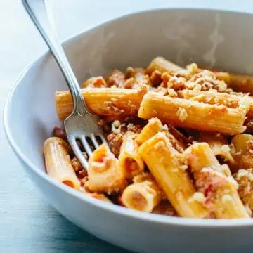 bowl of rigatoni pasta with a fork