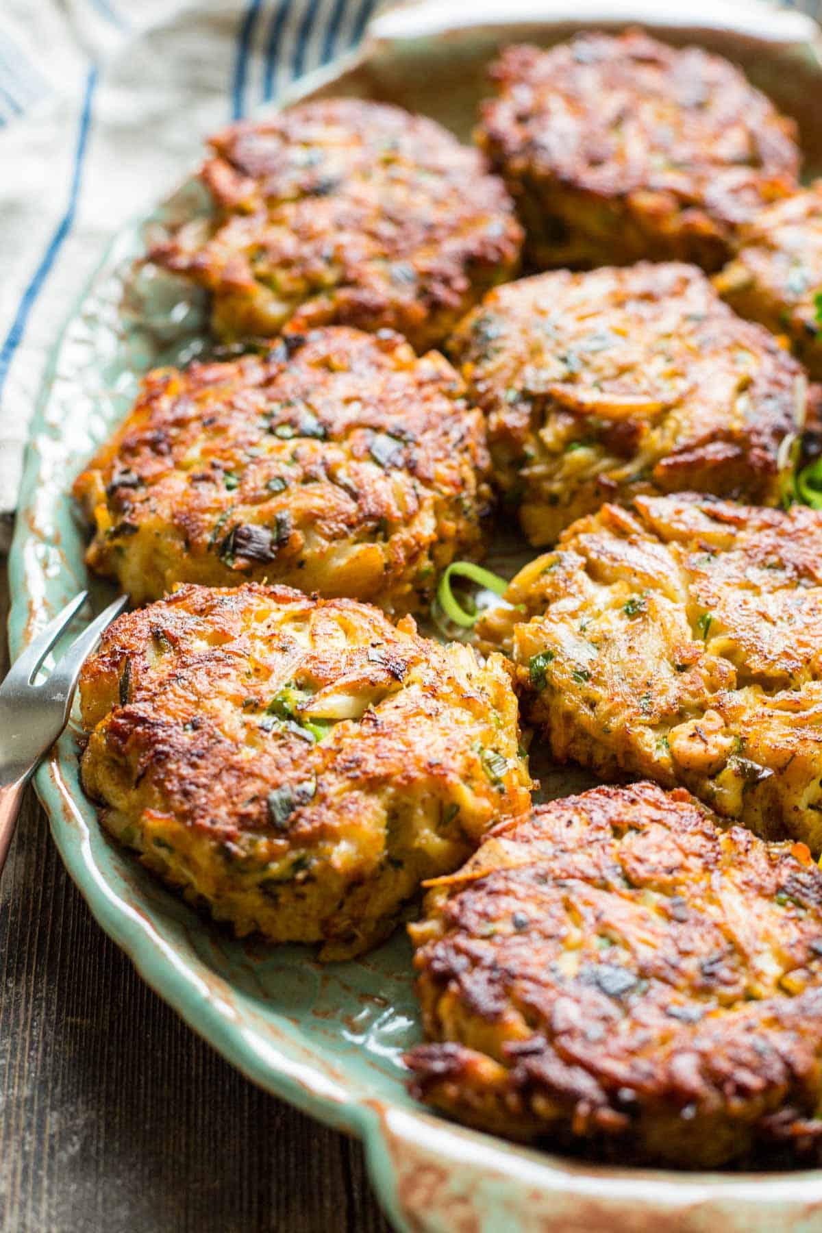 close up of fried crab cakes on a platter