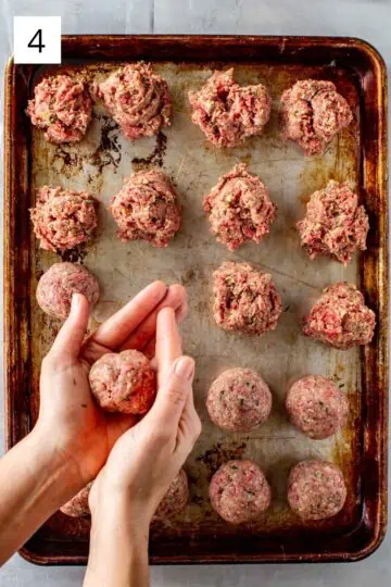 Forming meatballs with hands and setting on baking sheet.