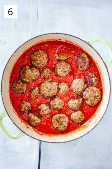 Italian style meatballs simmering in a homemade sauce.