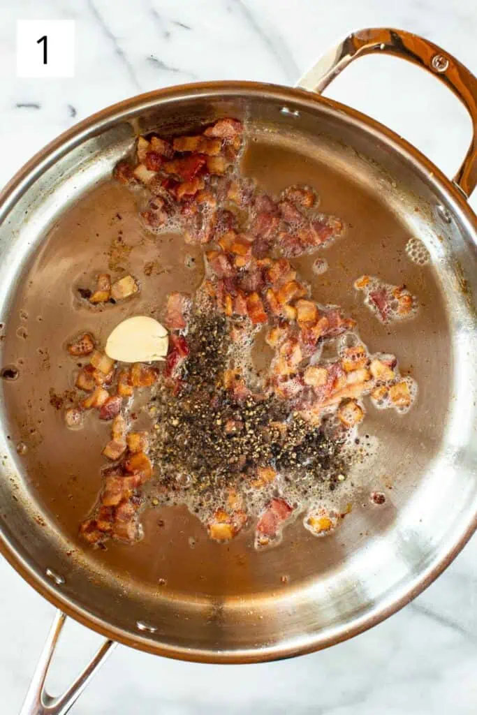 Bacon, garlic and black pepper cooking in a pan.