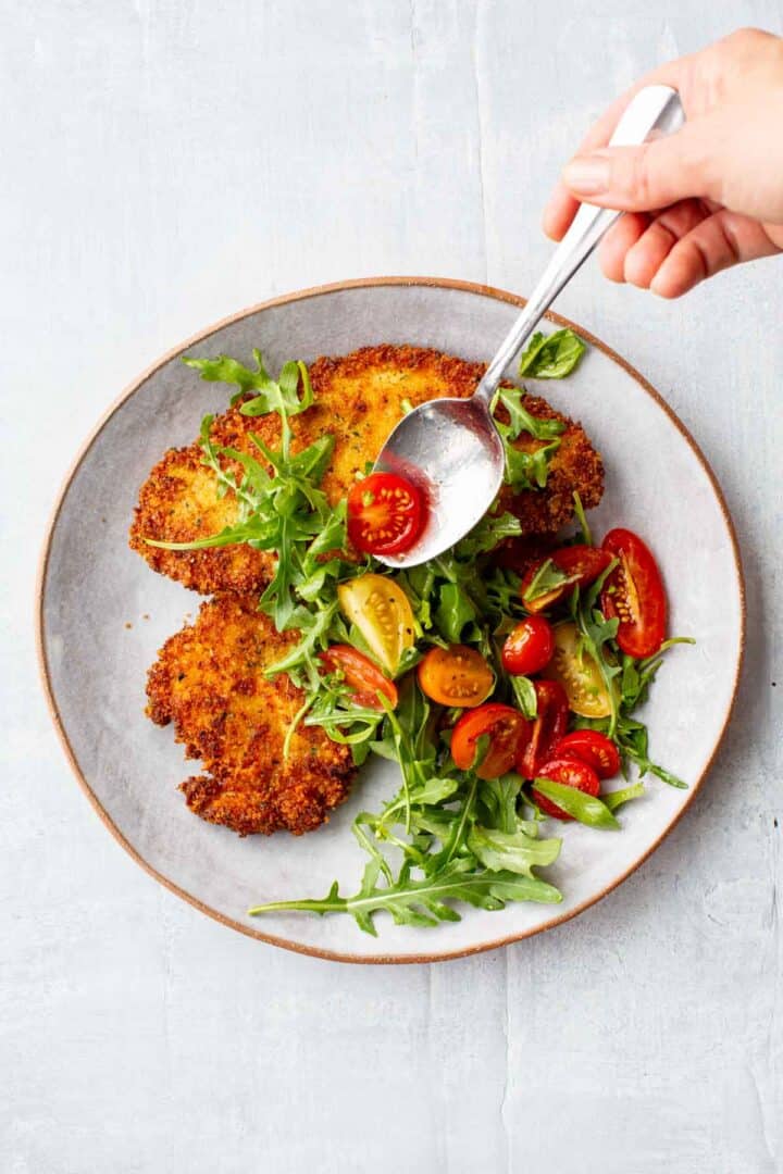 Crispy Chicken Milanese with Tomato Arugula Salad - Coley Cooks