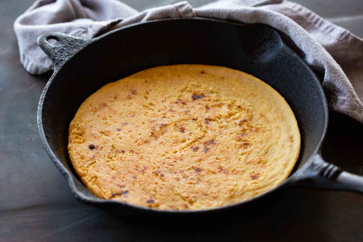 Close up of a baked chickpea flatbread.