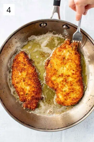 Frying breaded chicken in a skillet with olive oil