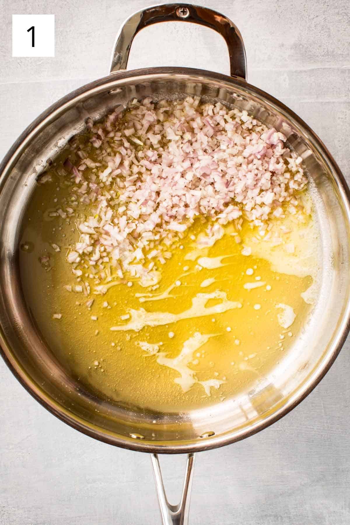 Cooking minced garlic and shallots in olive oil.