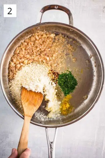 Breadcrumbs, oregano, parsley, garlic, red pepper flakes, and other ingredients added to a pan.
