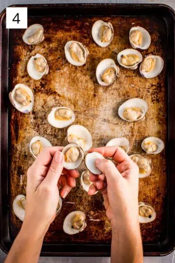 Halving clams for oreganata recipe.