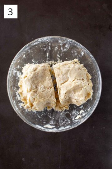 Separating pie crust dough into sections. 