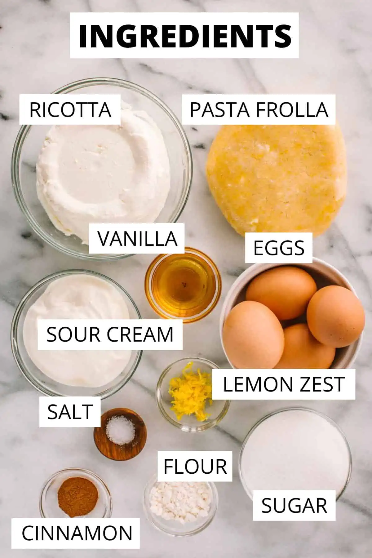 Recipe ingredients for ricotta pie portioned out in small bowls.