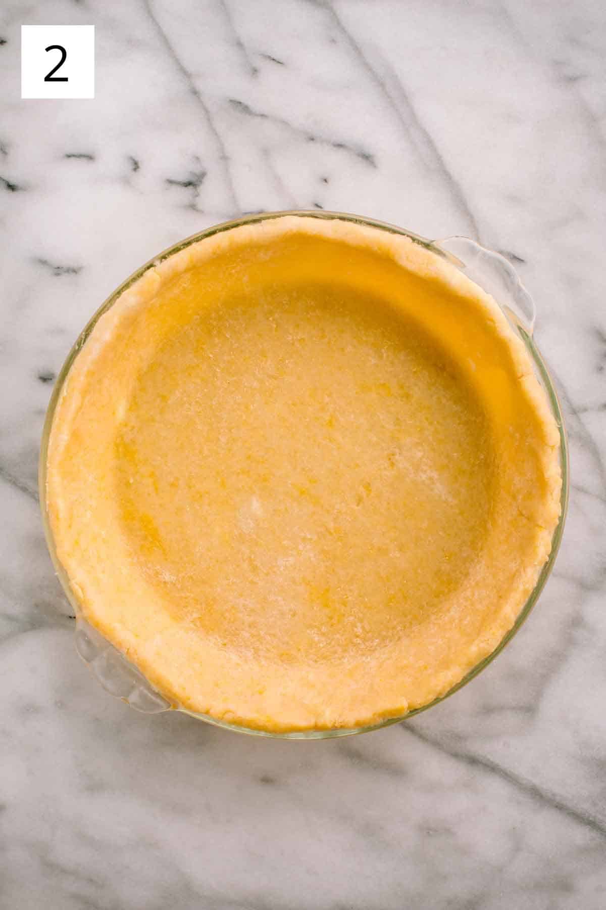 Sweet pie crust pressed into dish before baking.