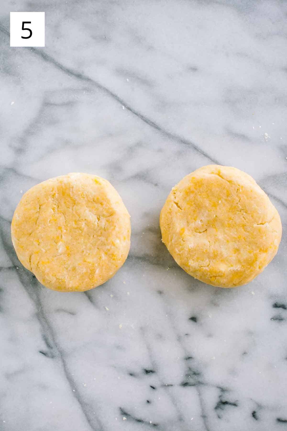 Two discs of pasta frolla shortcrust pastry dough.