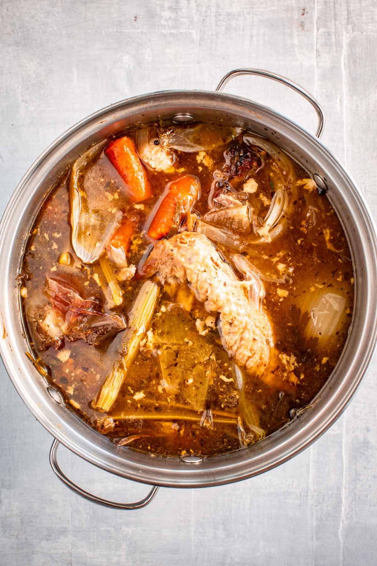 A pot of cooked turkey stock.