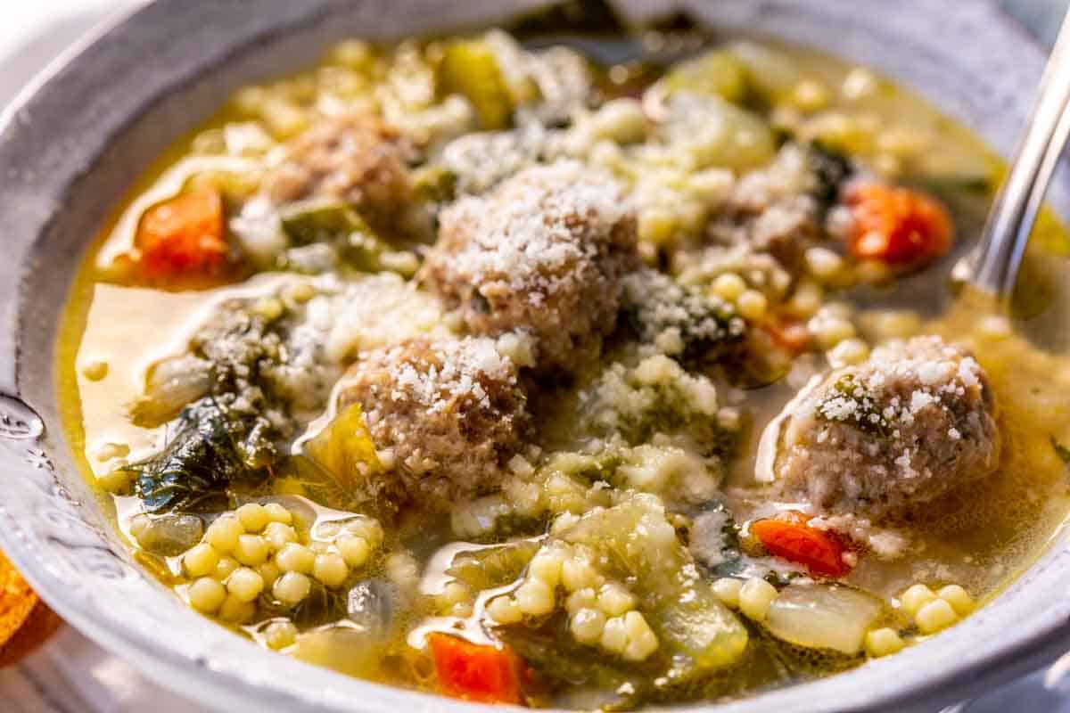 Close up of Italian wedding soup with meatballs.