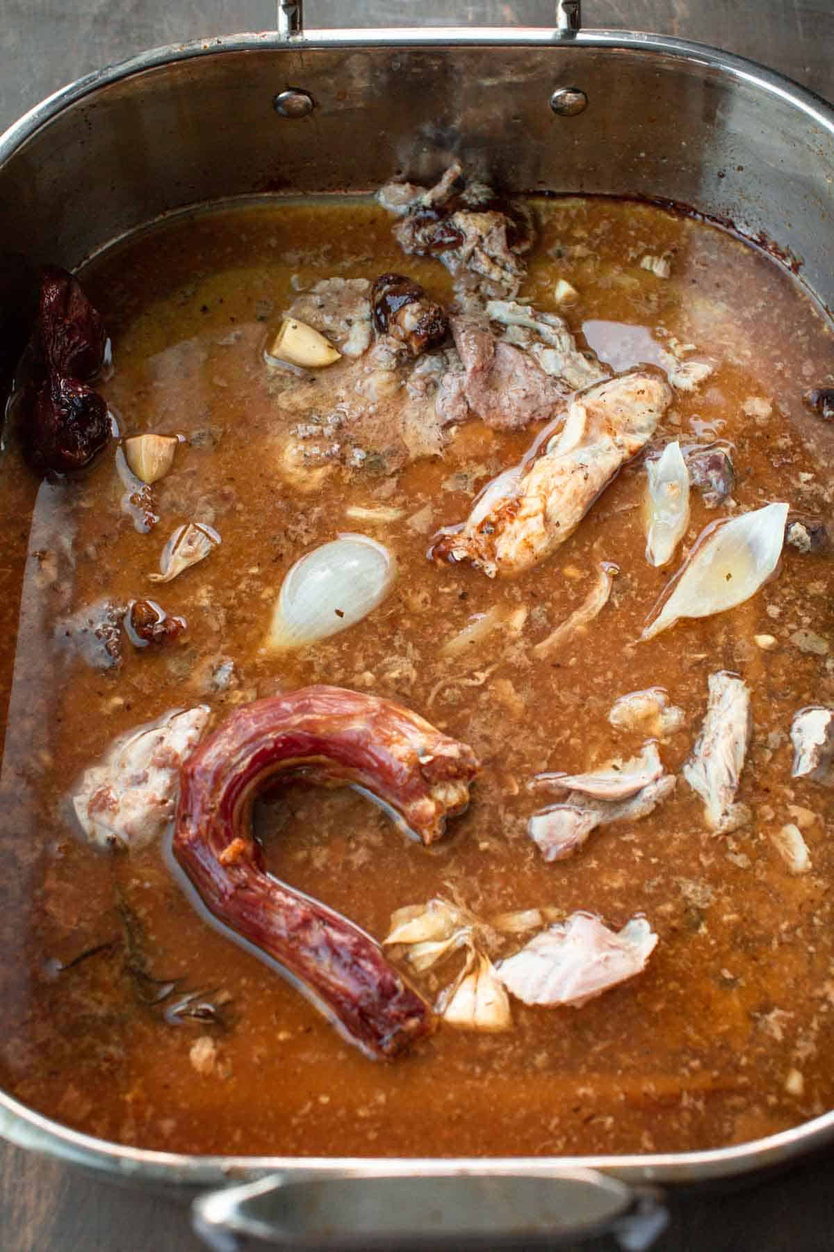 A pan filled with turkey drippings.