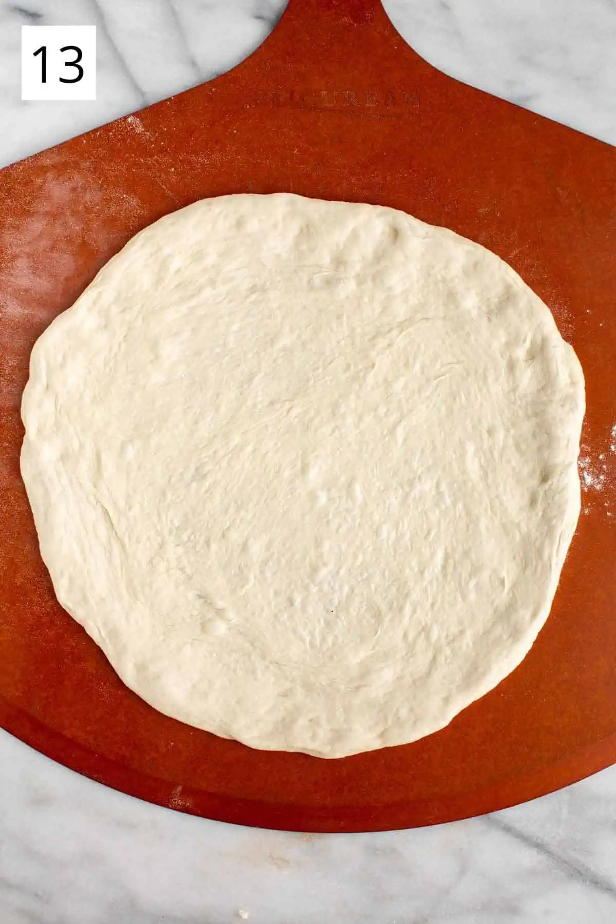 Rolled out pizza dough ready for toppings.