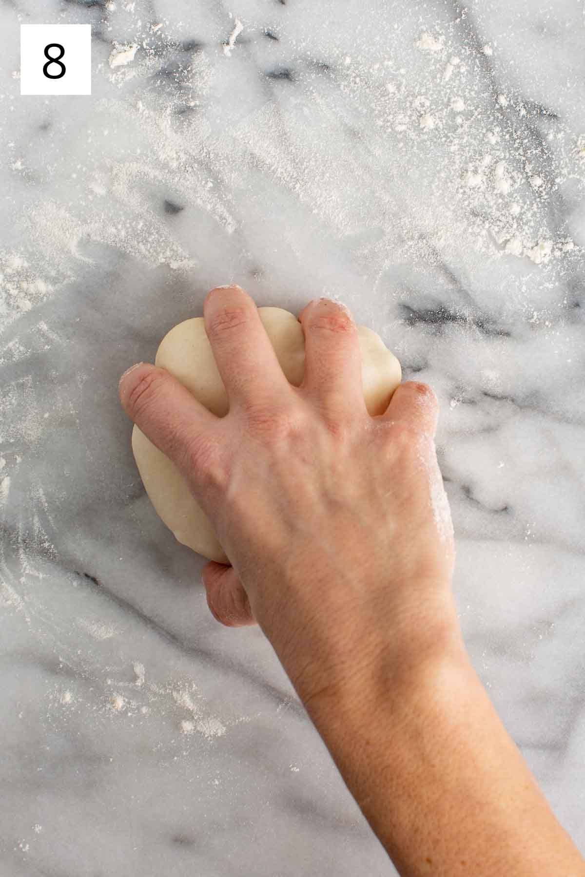 Prepping pizza dough for rising.