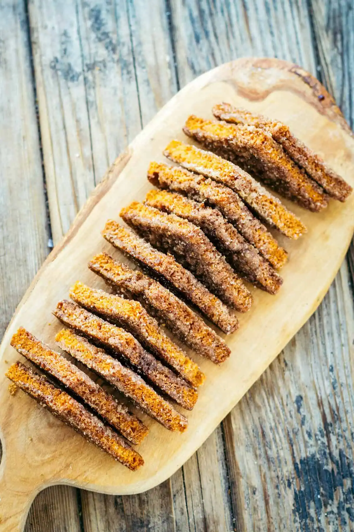 A long row of triangular shaped cinnamon toast.