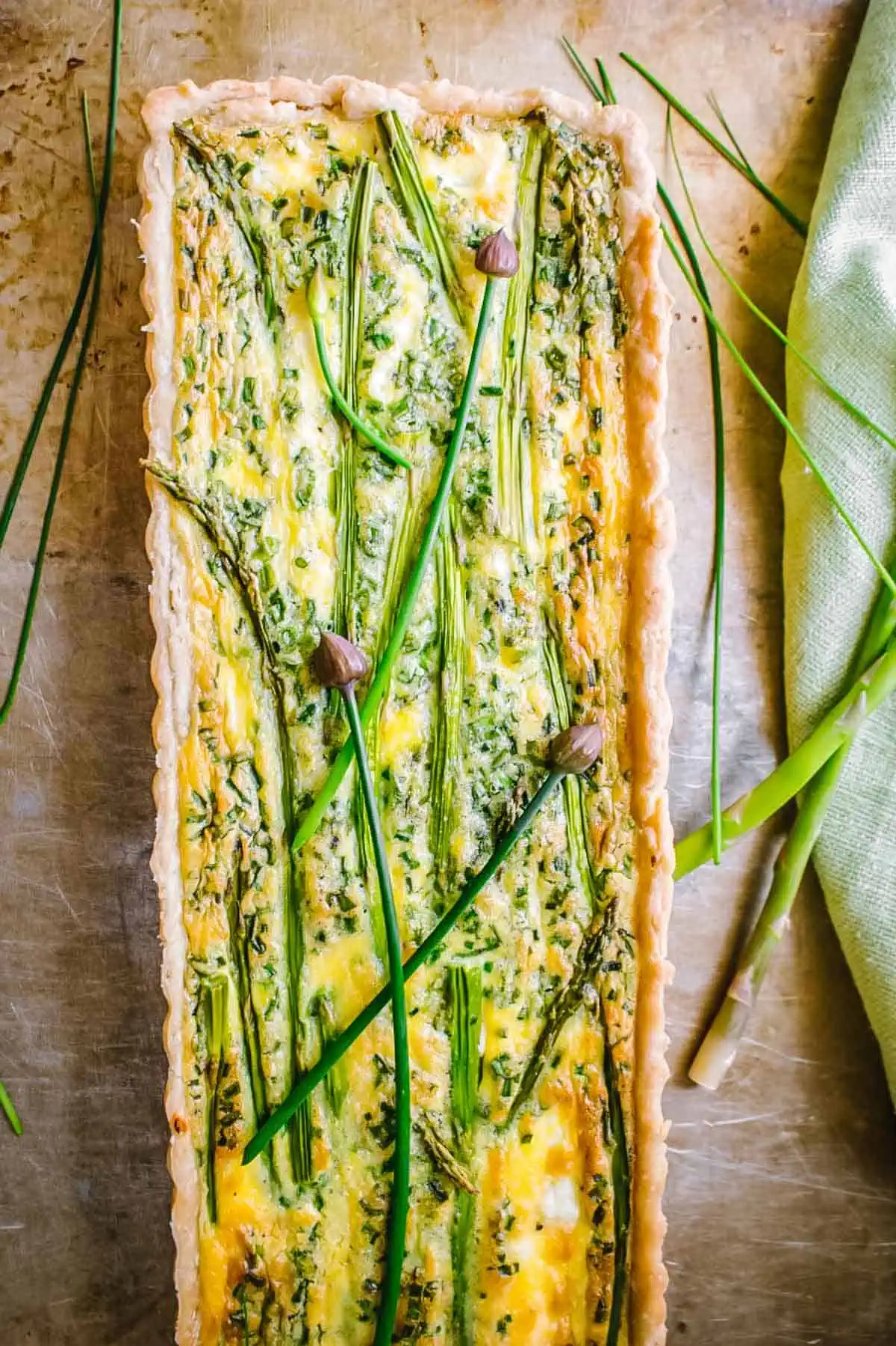 A long rectangular asparagus and goat cheese quiche.