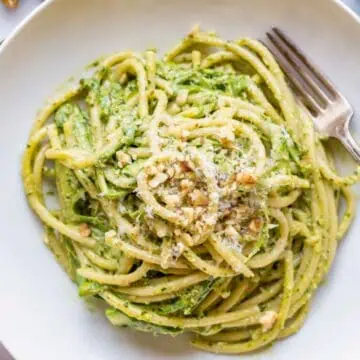 a bowl of spaghetti with shaved asparagus and ramp pesto.