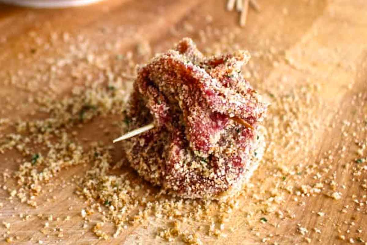 A beggars purse beef spiedini secured with a toothpick.