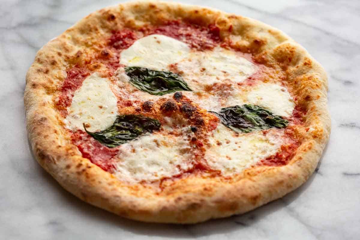 A Margherita pizza with fresh mozzarella and basil.