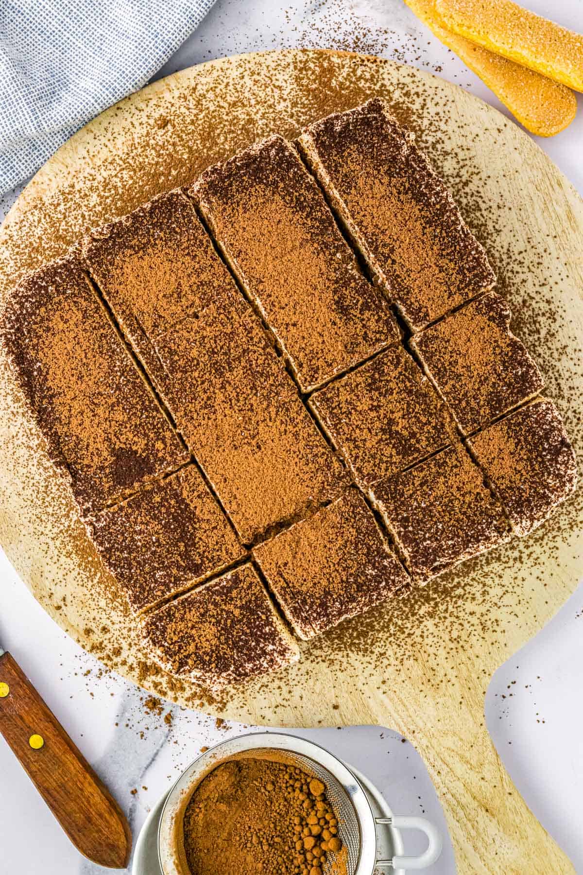 Top view of brownies duster with cocoa.